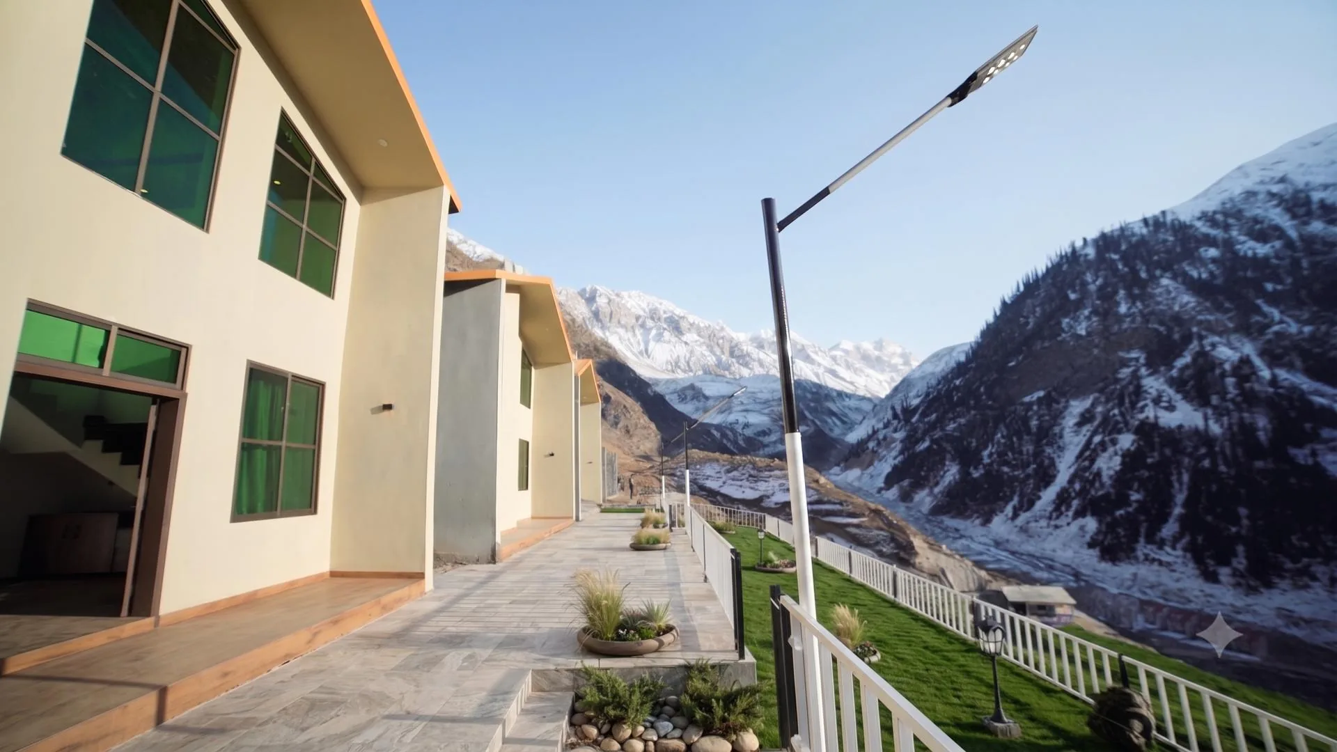 Naran Club cottages overlooking the snow-capped peaks of Kaghan Valley